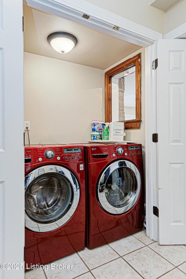 washroom with separate washer and dryer and light tile patterned floors