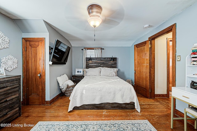 bedroom featuring hardwood / wood-style flooring and ceiling fan