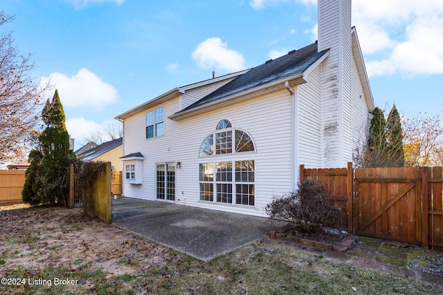 back of house with a patio area