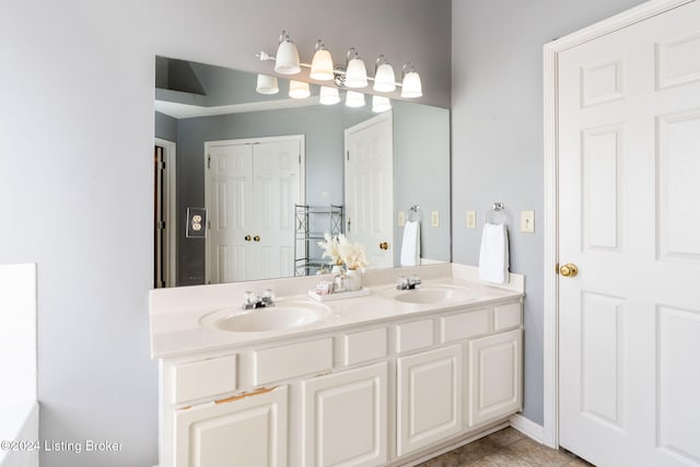 bathroom featuring tile patterned flooring and vanity