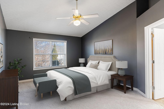 carpeted bedroom featuring ceiling fan and lofted ceiling