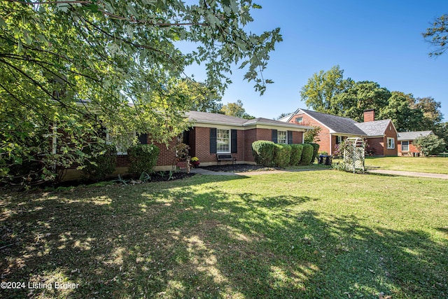 ranch-style house with a front yard