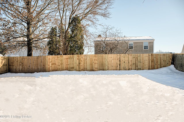 view of yard covered in snow