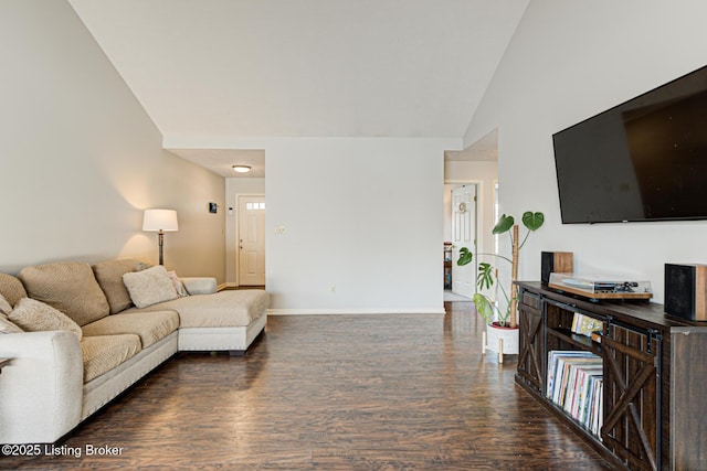 living room with vaulted ceiling and dark hardwood / wood-style floors