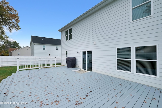 wooden deck featuring area for grilling