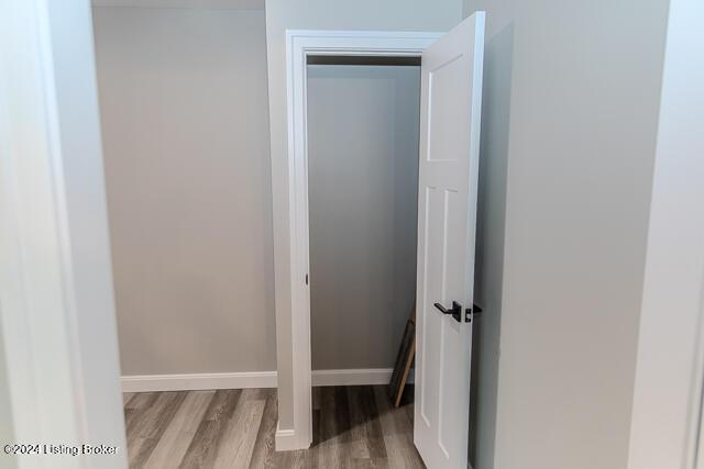 bathroom with hardwood / wood-style flooring