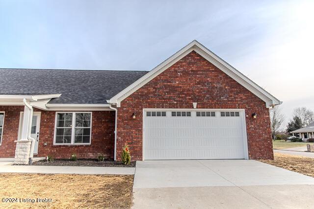 363 S Hamilton Ave, Hanover, IN 47243 - ranch-style home with driveway, brick siding, a garage, and roof with shingles