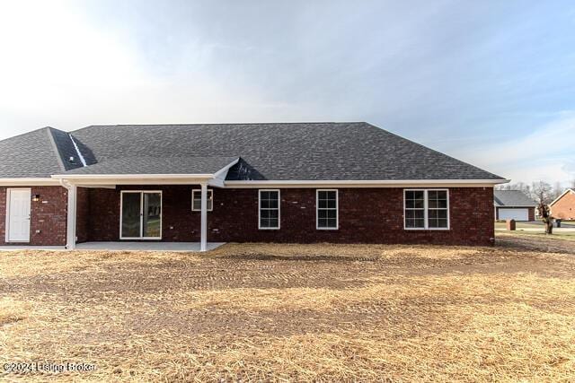 rear view of property featuring a patio