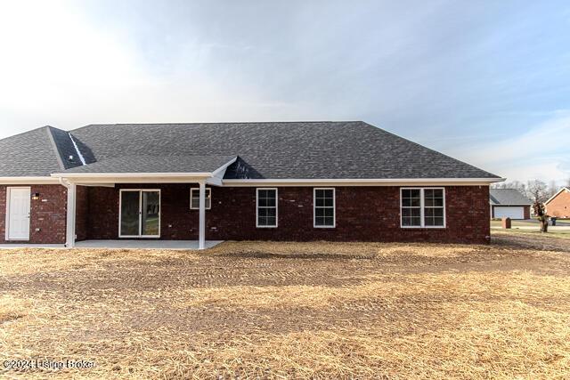 363 S Hamilton Ave, Hanover, IN 47243 - rear view of house featuring a patio, roof with shingles, and brick siding