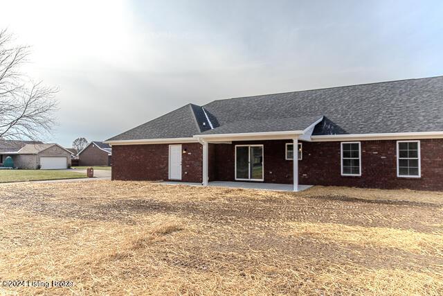 363 S Hamilton Ave, Hanover, IN 47243 - single story home with a patio area, roof with shingles, and brick siding