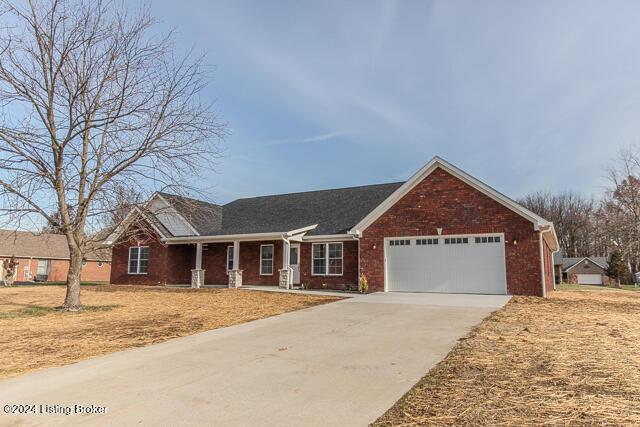 363 S Hamilton Ave, Hanover, IN 47243 - ranch-style home featuring an attached garage, driveway, brick siding, and a porch