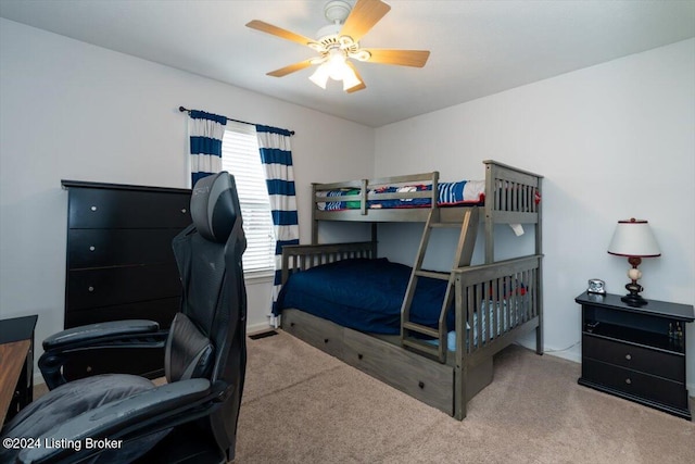 bedroom featuring ceiling fan and light carpet