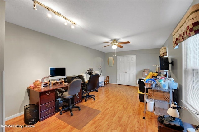 office area featuring light hardwood / wood-style flooring and ceiling fan