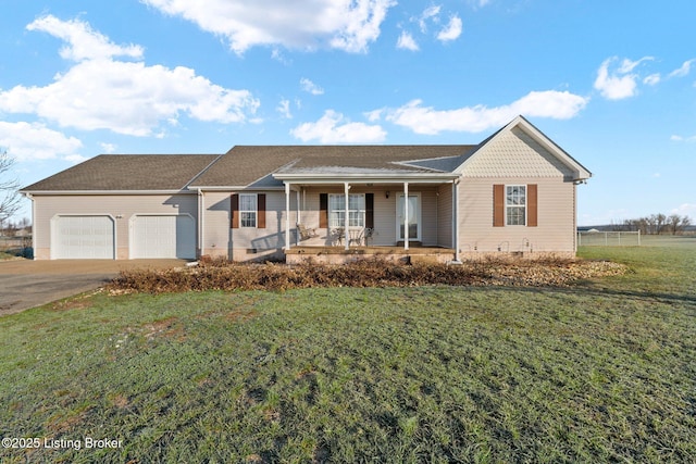 single story home with covered porch, a front yard, and a garage