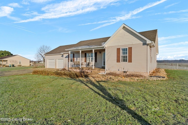 view of front facade with a garage, a porch, and a front yard