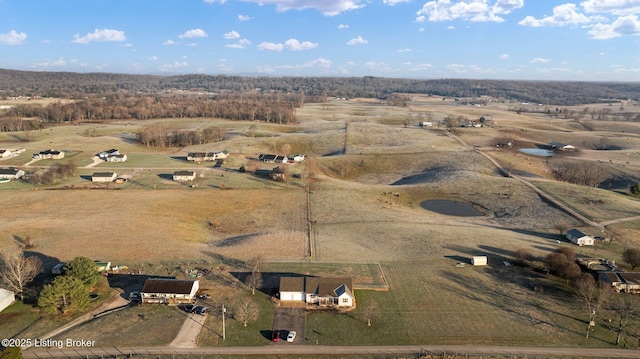 birds eye view of property with a rural view