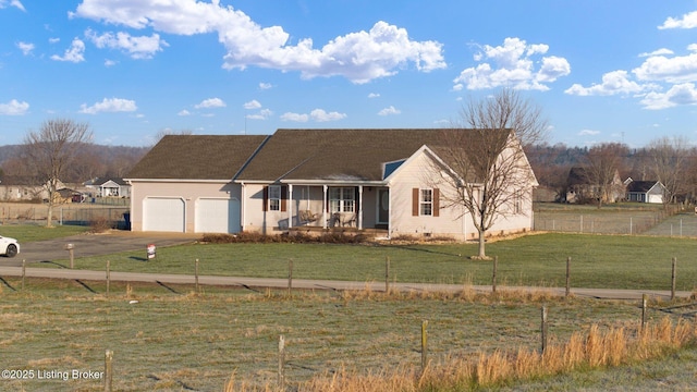 ranch-style house with a front yard and a garage