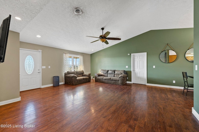 unfurnished living room with ceiling fan, dark hardwood / wood-style flooring, lofted ceiling, and a textured ceiling