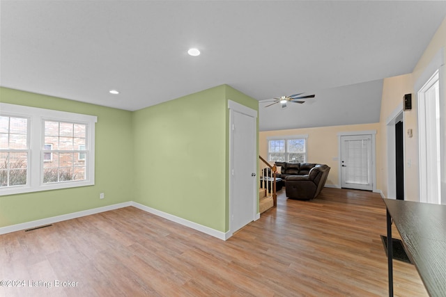 interior space with ceiling fan and light hardwood / wood-style flooring