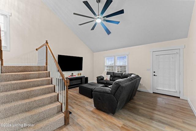 living room featuring wood-type flooring, high vaulted ceiling, and ceiling fan