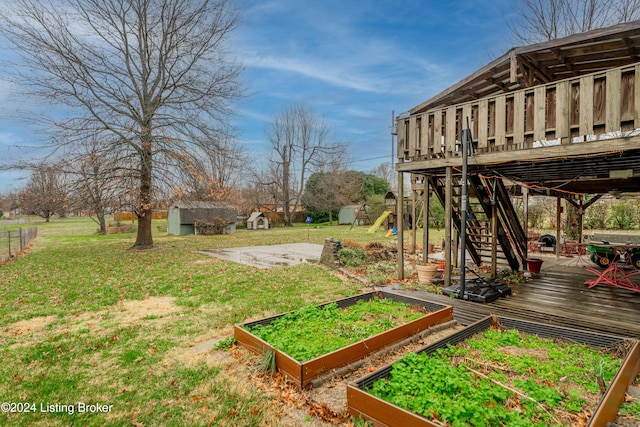 view of yard with a shed and a wooden deck