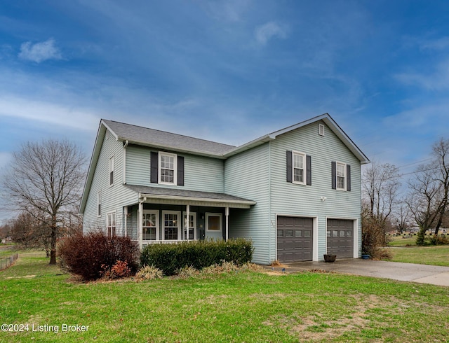 view of front property featuring a garage and a front yard