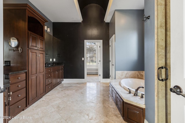 bathroom featuring vanity and shower with separate bathtub