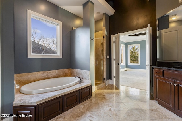 bathroom featuring vanity, separate shower and tub, a healthy amount of sunlight, and crown molding