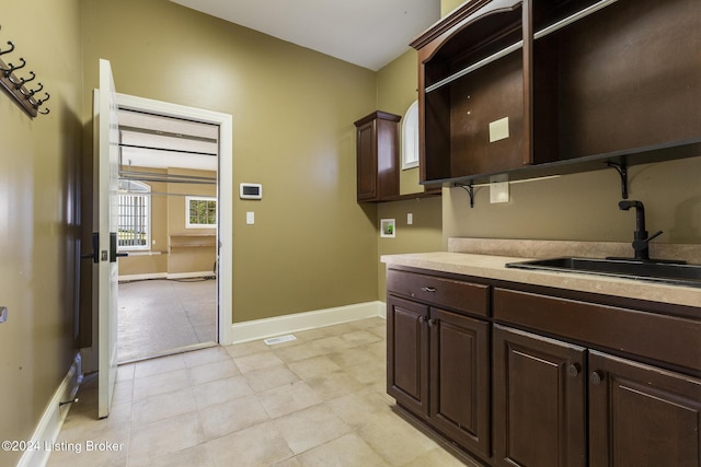 laundry area with sink, cabinets, and washer hookup