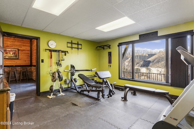 exercise area featuring a drop ceiling