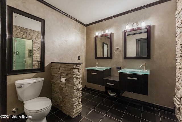 bathroom featuring tile patterned flooring, vanity, toilet, and crown molding