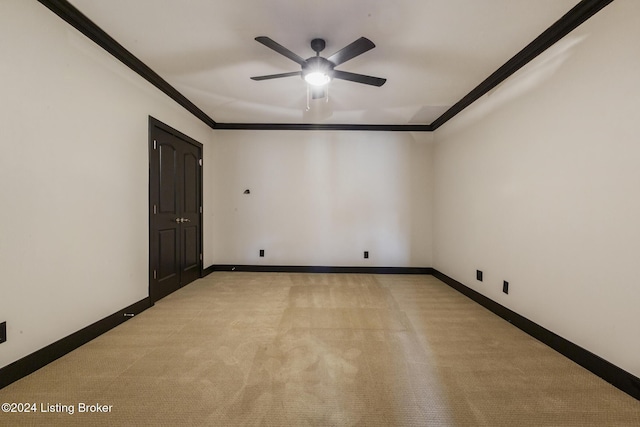 unfurnished room with light carpet, ceiling fan, and ornamental molding