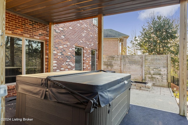 view of patio with a hot tub