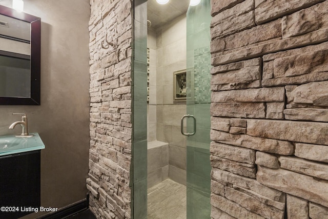 bathroom with vanity and an enclosed shower