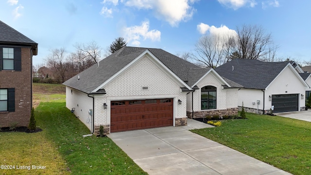 view of front facade with a front lawn and a garage