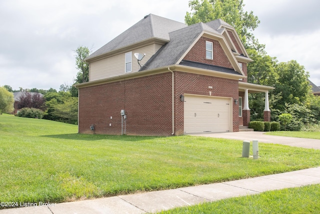 view of property exterior featuring a lawn and a garage