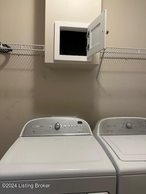 laundry area featuring washing machine and clothes dryer