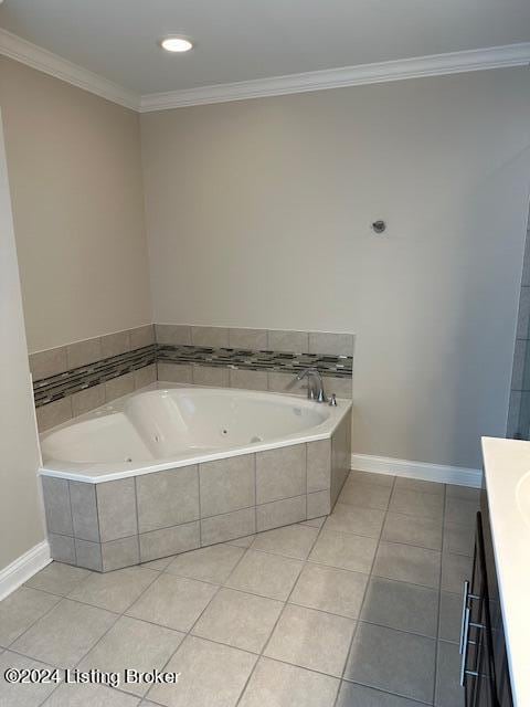 bathroom featuring tile patterned floors, vanity, ornamental molding, and tiled bath