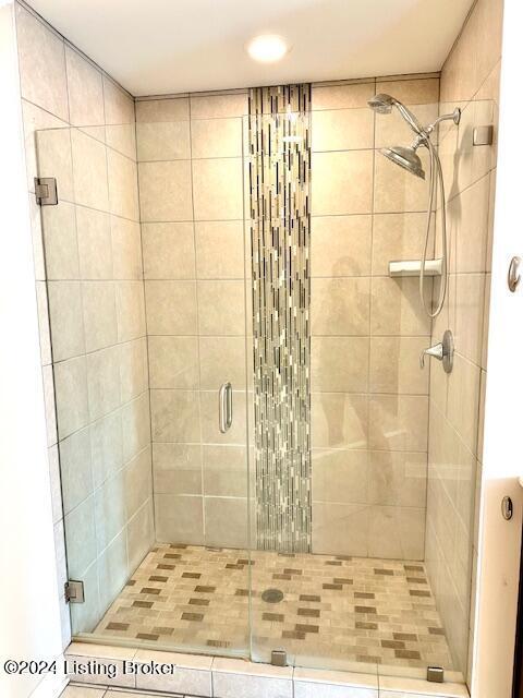 bathroom featuring an enclosed shower