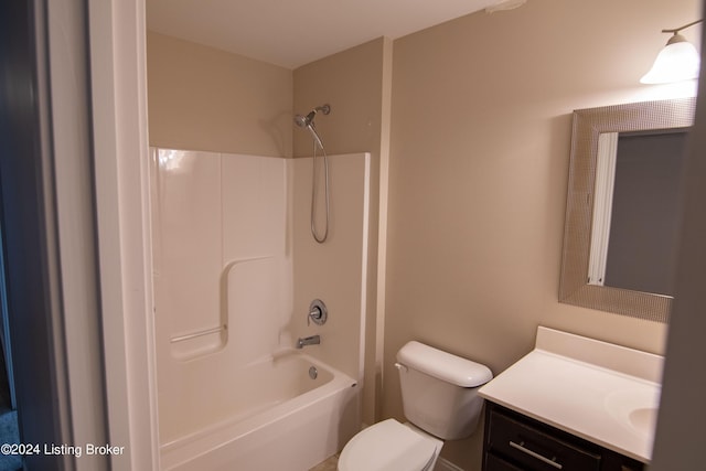 full bathroom with bathtub / shower combination, vanity, and toilet