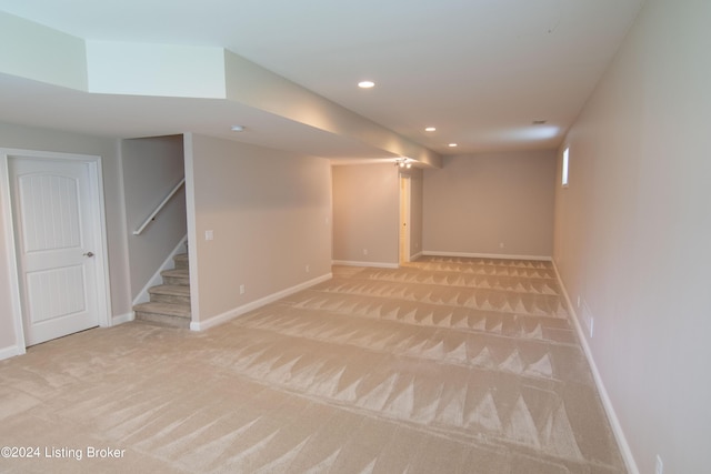 basement with light colored carpet