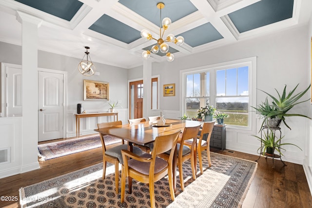 dining room featuring beamed ceiling, ornamental molding, and coffered ceiling