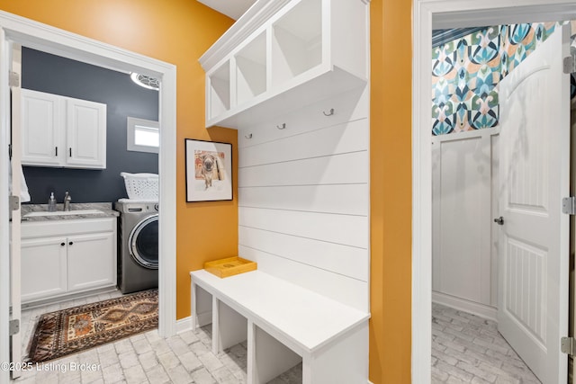 mudroom with washer / clothes dryer and sink