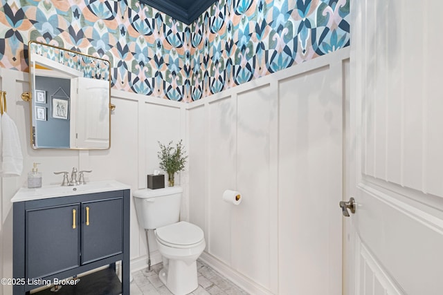 bathroom with toilet and vanity