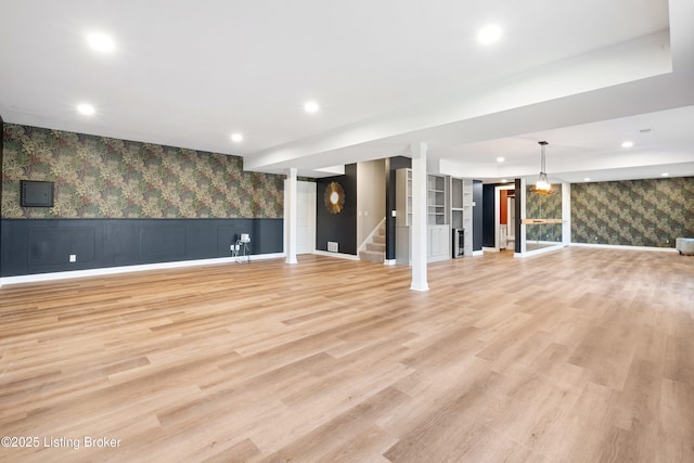 unfurnished living room with light hardwood / wood-style flooring