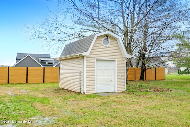 garage featuring a yard