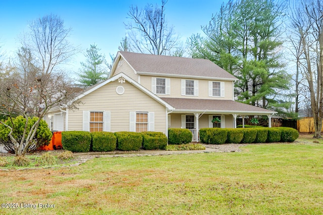 view of front of home with a porch and a front lawn