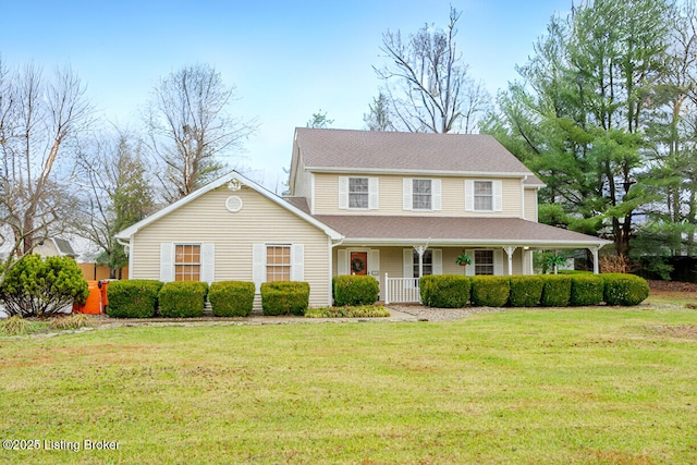 view of front of property featuring a front lawn and covered porch