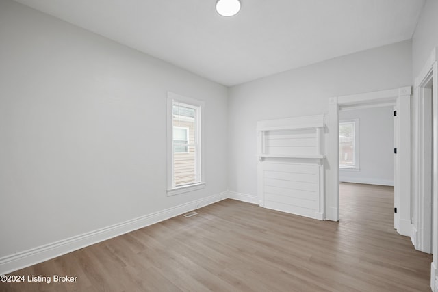 empty room with light hardwood / wood-style flooring