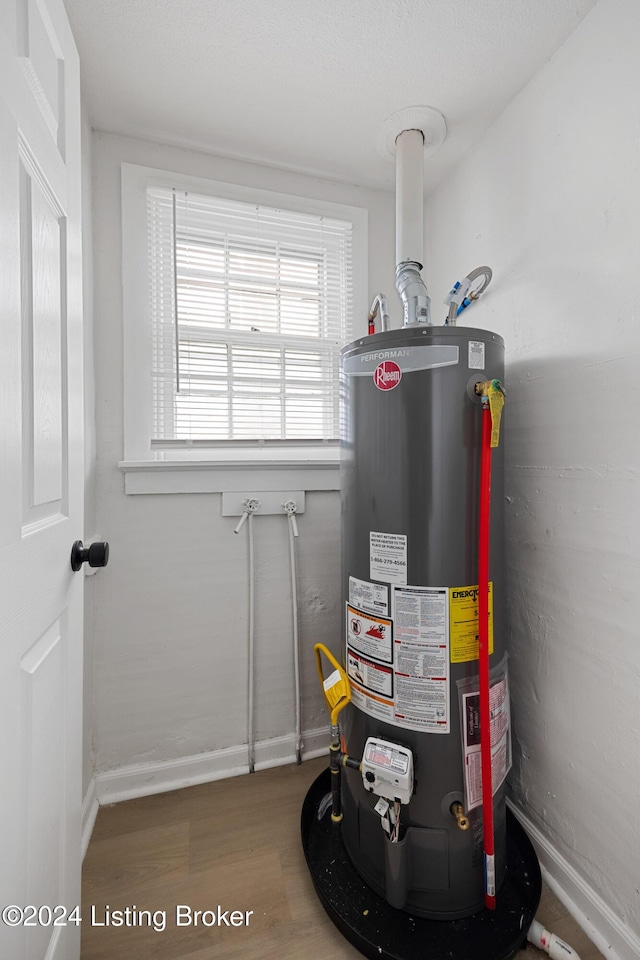 utility room with water heater